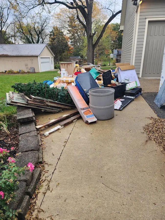 Dumpster being loaded with debris for Residential Dumpster Rental in Lealman